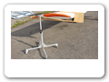 The stand is equipped with a spring and allows rotating and sliding the wing gradually aligning itself. 